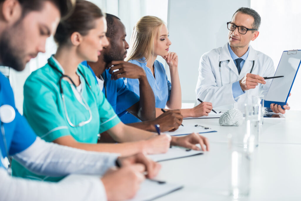 team of doctors and general practitioner having conversation